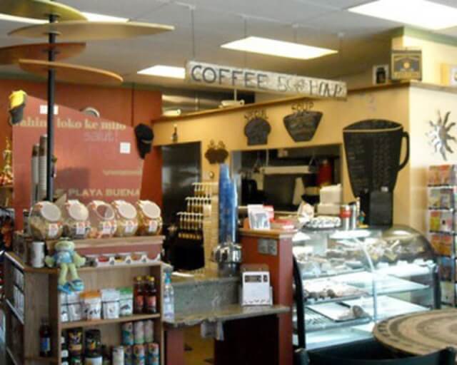 A cozy coffee shop with a variety of drinks, baked goods, and snacks displayed in Grand County Colorado.